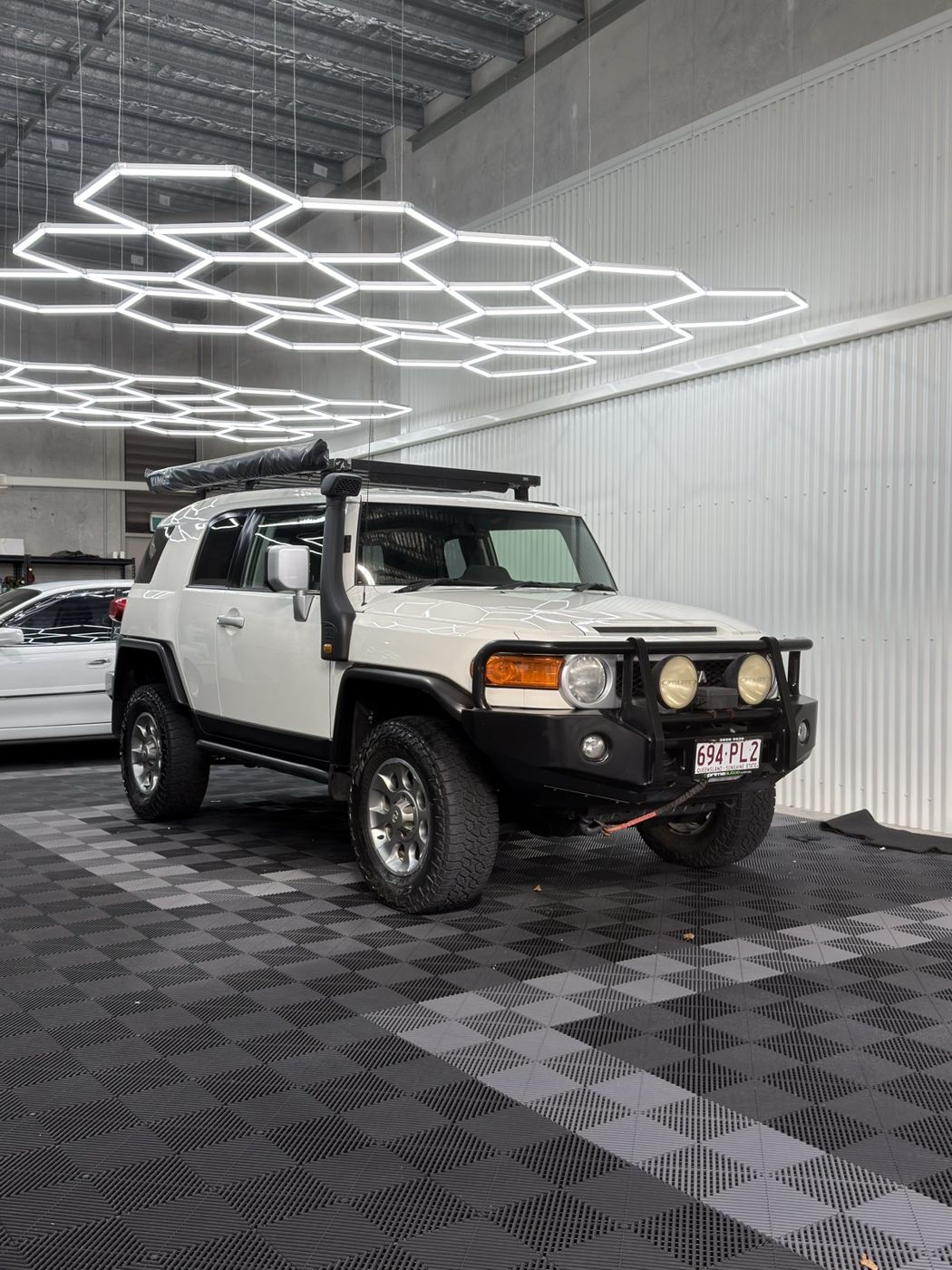 White FJ Cruiser in for ceramic coating