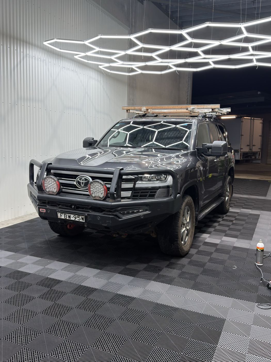 Grey LandCruiser 300 in for a detail